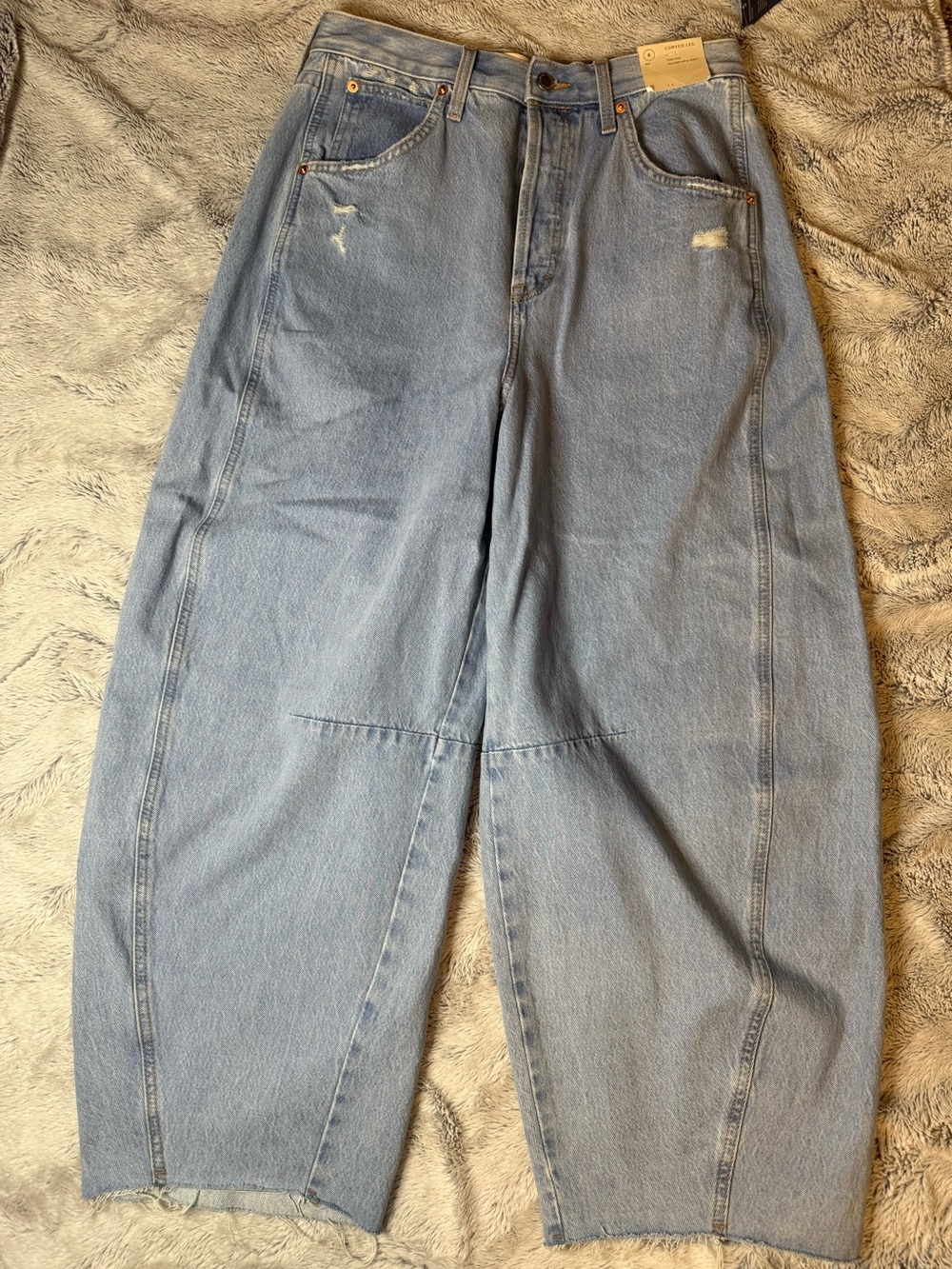 Light-washed high-rise barrel-leg jeans with curved seams size 8